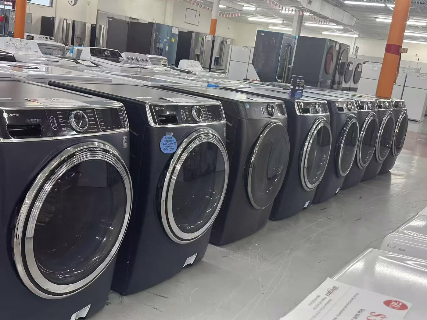 Front-load washers in a long row on the Pensacola floor