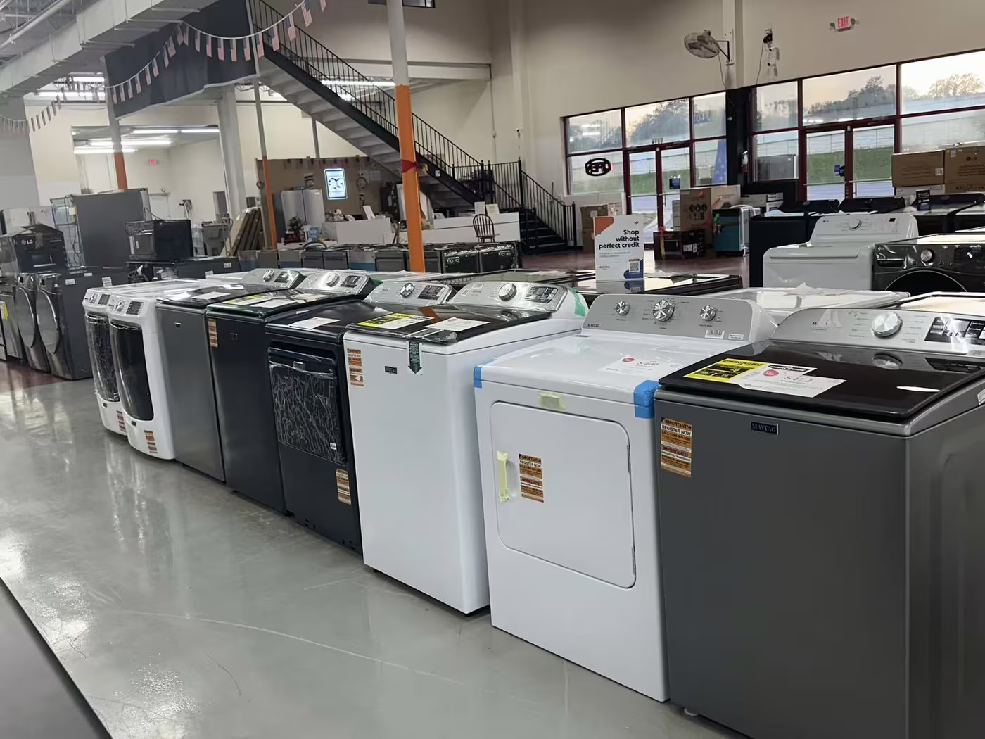 Top-load washers and dryers on the Pensacola floor