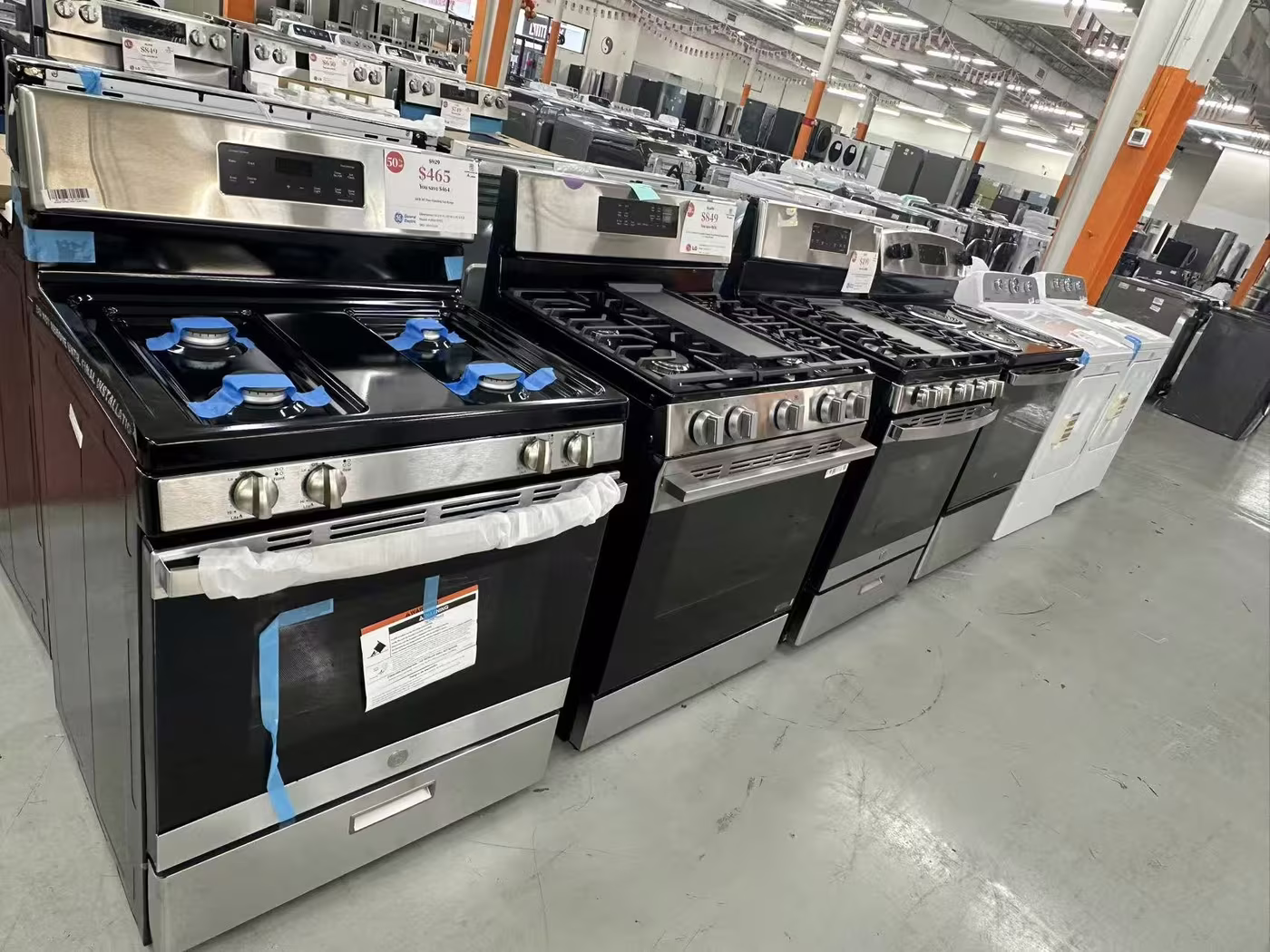 Gas ranges with price tags on the Pensacola floor