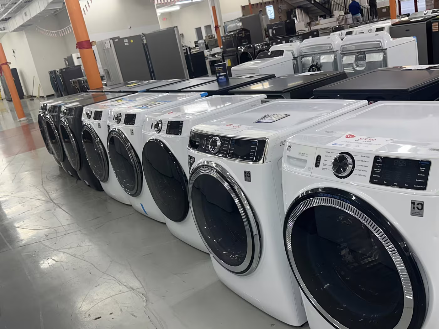 White front-load washers on the Pensacola floor