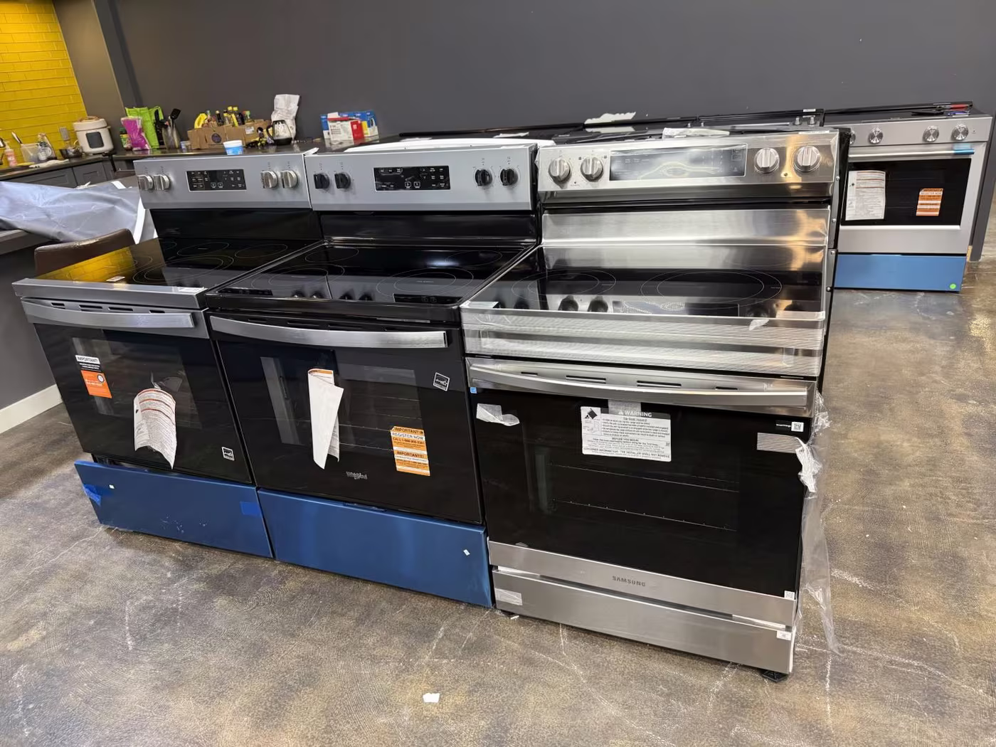 Stainless and black electric ranges on the Tallahassee floor